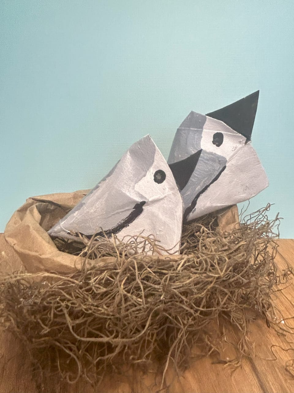 Toilet paper roll birds in a nest craft